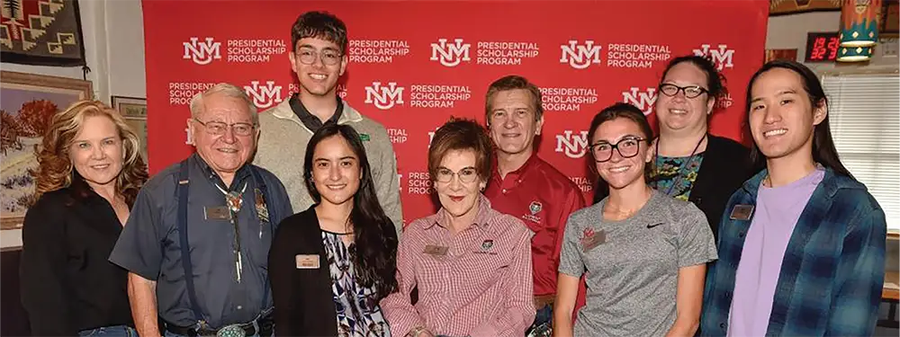 The Rainosek family with Presidential Scholarship Program recipients at the Frontier Restaurant