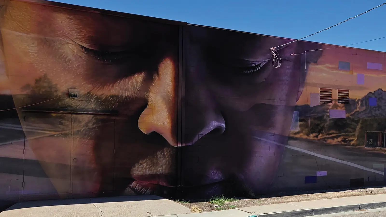 Route 66 Remixed mural Mother Moment on the exterior of UNM ARTSLab
