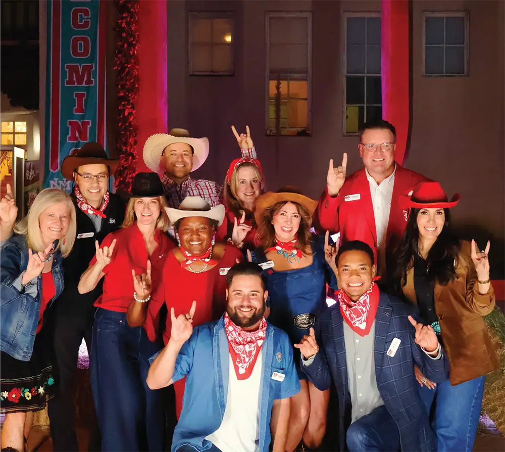Aprilyn Chavez Geissler with UNM Alumni Board members during Homecoming