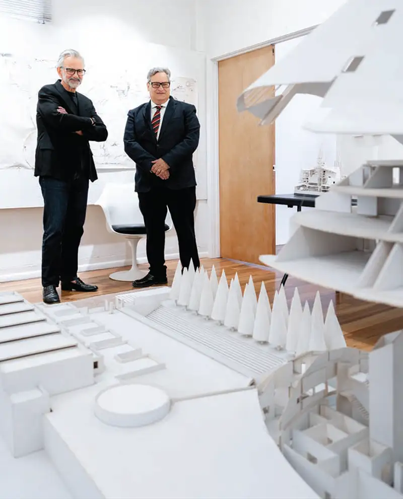 Mark Woodbury and Dean Robert Gonzalez viewing an architectural model