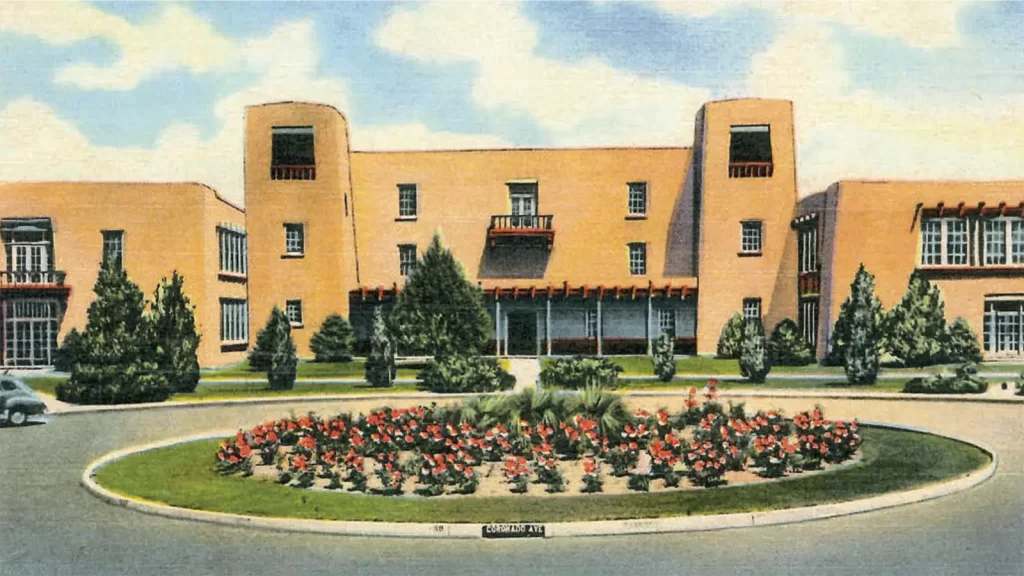 Historic postcard showing the Kimo Theatre and Public Service Company of New Mexico on Route 66