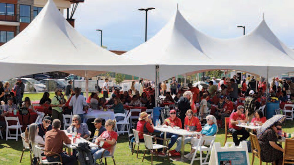 UNM graduates, family and friends gathered at Winrock Park for the Albuquerque Green Chile Roast