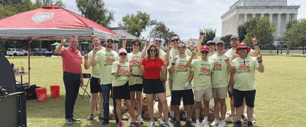 UNM Alumni Washington, D.C. Green Chile Roast group with the Lincoln Memorial in the background